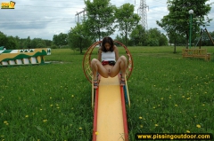 Outdoor pissing on a park slide - N