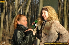 Two girls outdoor pissing on stone columns - N