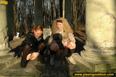 Two girls outdoor pissing on stone columns - N