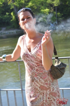 Brunette babe smoking at the riverside - N