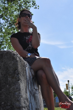 Brunette babe smoking at the park - N