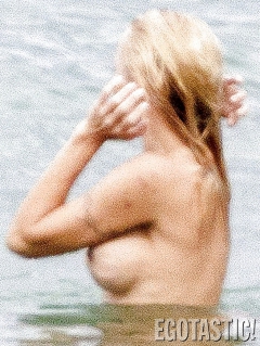 Pamela Anderson Goes Topless on a Beach in France - N