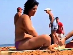 thick-woman-wth-big-breasts-at-a-beach