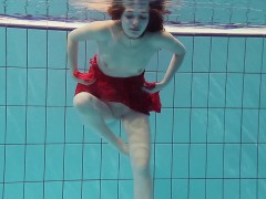 red-dressed-teen-swimming-with-her-eyes-opened