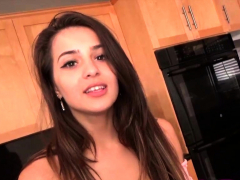 Sexy brunette talking about sex in the kitchen