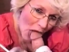 very-hot-granny-with-glasses-smoking-while-sucking-dick