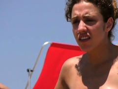 Sexy brunette woman Topless Beach Voyeur