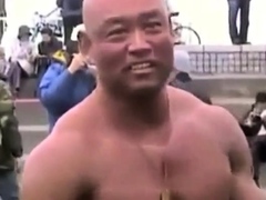 asian-bodybuilder-barely-covered-at-the-beach